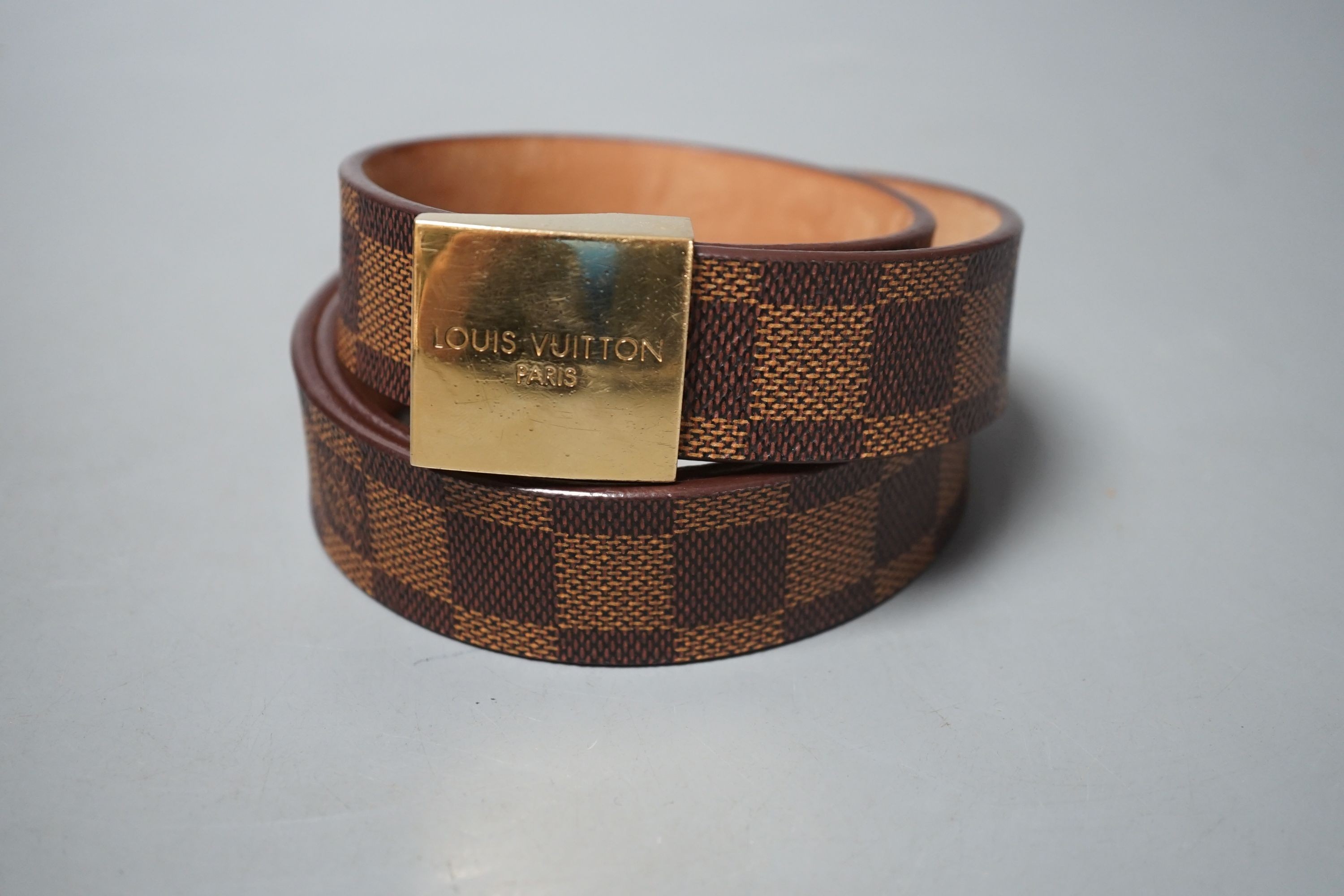 A brown leather women’s Louis Vuitton Damier pattern belt, in original box